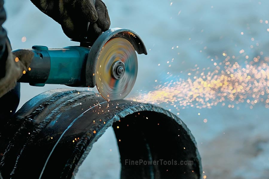 Angle Grinder cutting metal pipe