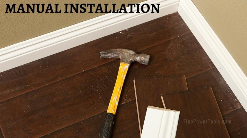 Installating quarter round with hammer and nail